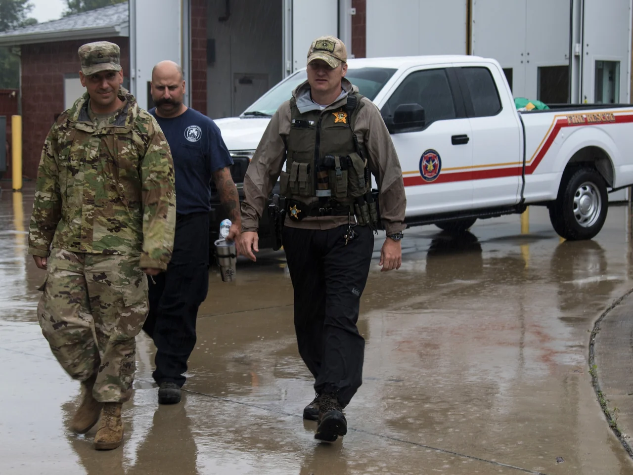 A Florida National Guard soldier, St. Johns County firefighter and Sheriff’s Office detective during a Hurricane Dorian site survey in Ponte Vedra, 2019.